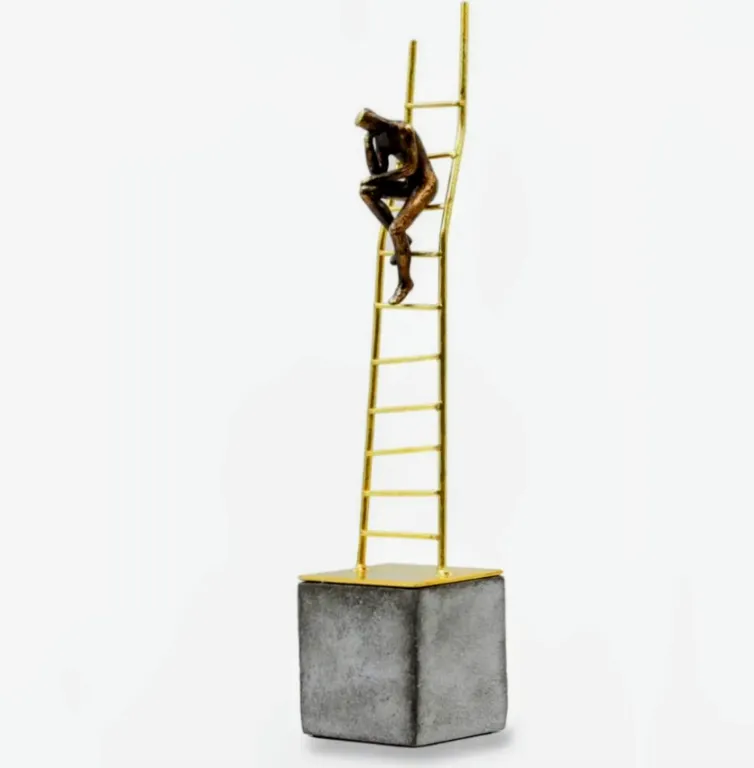 Thinking man on a ladder