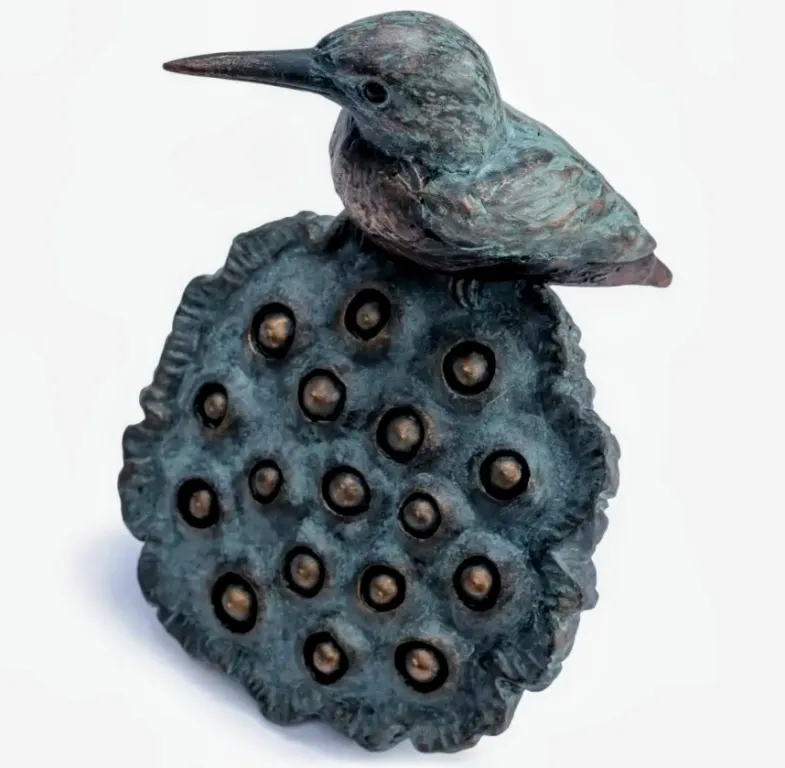 Kingfisher on lotus flower